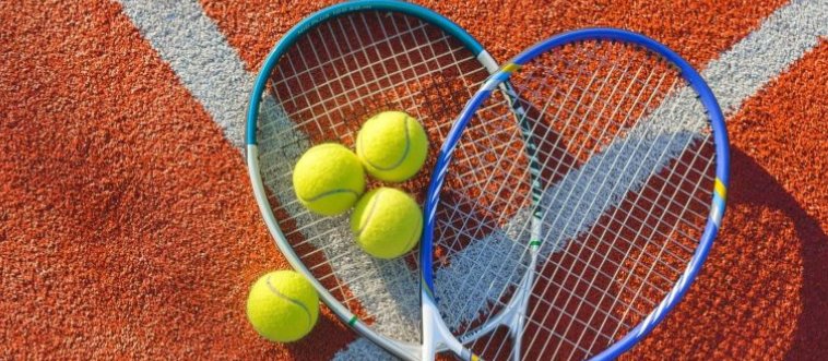 Identify the sport employing a fuzzy yellow ball, a strung racket, and a net bisecting the court.